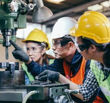 field service technicians working on a machine